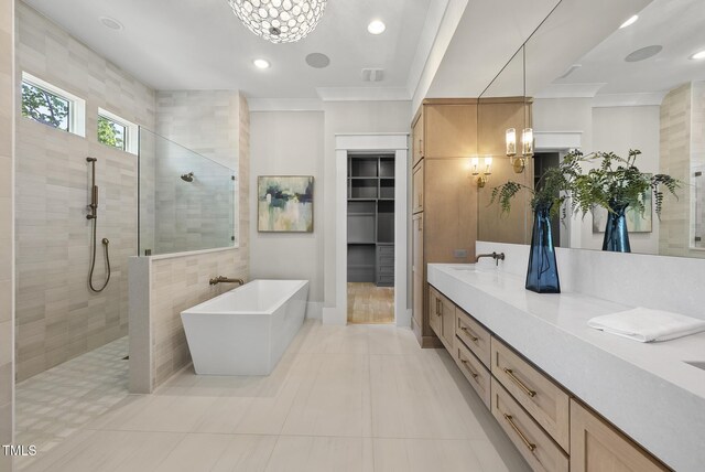 7417 Dover Hills Dr Unit 73, Wake Forest, NC 27587 - bathroom featuring walk in shower, a freestanding tub, a chandelier, double vanity, and crown molding