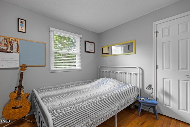 bedroom featuring wood finished floors