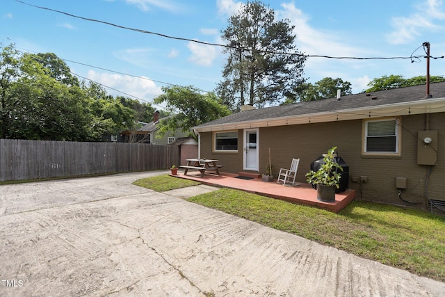 back of property featuring a patio area and a chimney