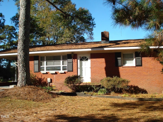 6383 Elevation Rd, Benson, NC 27504 - single story home featuring brick siding and a chimney