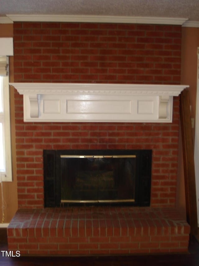 6383 Elevation Rd, Benson, NC 27504 - detailed view of a large fireplace, crown molding, and a textured ceiling