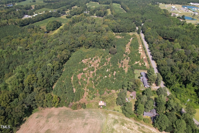 6383 Elevation Rd, Benson, NC 27504 - aerial view of property's location with a heavily wooded area and a large body of water