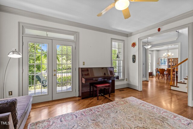 100 Michaels Way, Chapel Hill, NC 27516 - sitting room featuring french doors, a chandelier, healthy amount of natural light, wood finished floors, and ornamental molding