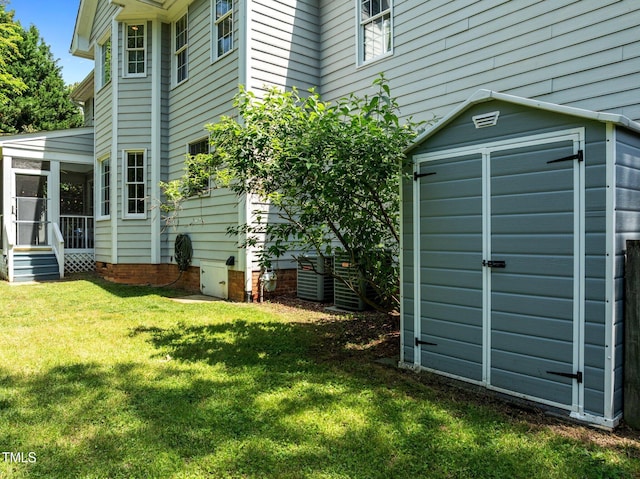100 Michaels Way, Chapel Hill, NC 27516 - exterior space with a sunroom, a lawn, a storage shed, an outbuilding, and central air condition unit