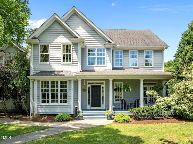 100 Michaels Way, Chapel Hill, NC 27516 - view of front facade featuring a porch, a front yard, and a shingled roof
