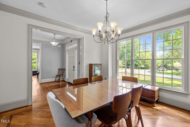 100 Michaels Way, Chapel Hill, NC 27516 - dining space featuring plenty of natural light, a chandelier, crown molding, baseboards, and wood finished floors