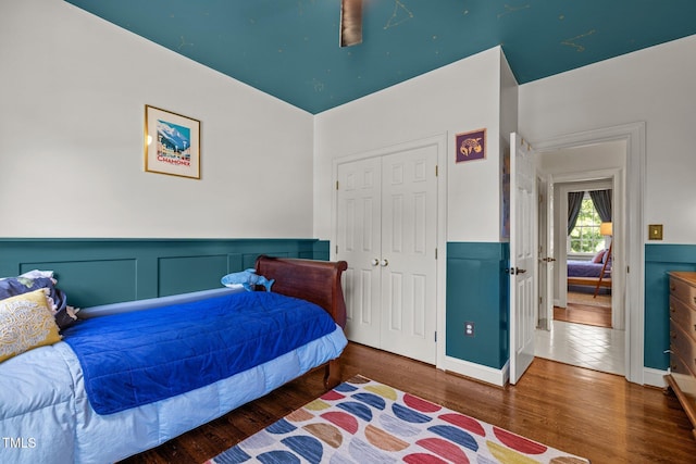 100 Michaels Way, Chapel Hill, NC 27516 - bedroom featuring wood finished floors, a wainscoted wall, a closet, baseboards, and a ceiling fan