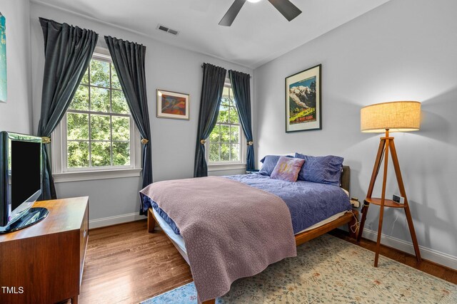 100 Michaels Way, Chapel Hill, NC 27516 - bedroom featuring baseboards, wood finished floors, and ceiling fan