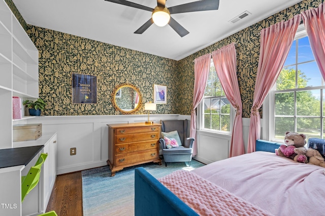 100 Michaels Way, Chapel Hill, NC 27516 - bedroom featuring wallpapered walls, wainscoting, wood finished floors, and a ceiling fan