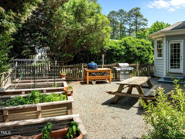 100 Michaels Way, Chapel Hill, NC 27516 - view of yard with a vegetable garden, fence, and view of wooded area