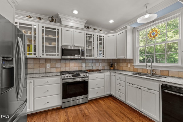 100 Michaels Way, Chapel Hill, NC 27516 - kitchen with appliances with stainless steel finishes, a sink, white cabinets, dark wood-style floors, and crown molding