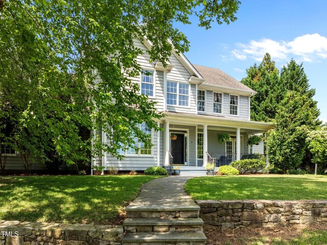 100 Michaels Way, Chapel Hill, NC 27516 - view of front facade featuring covered porch and a front lawn