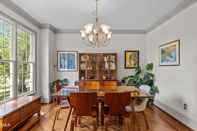 100 Michaels Way, Chapel Hill, NC 27516 - dining space with a chandelier, wood finished floors, crown molding, and baseboards