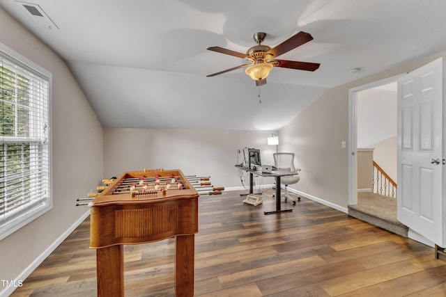 recreation room featuring a ceiling fan, lofted ceiling, hardwood / wood-style floors, and baseboards