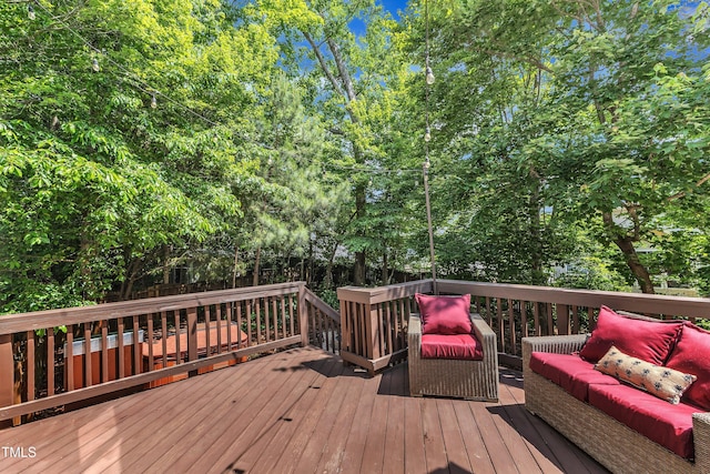 deck featuring outdoor lounge area