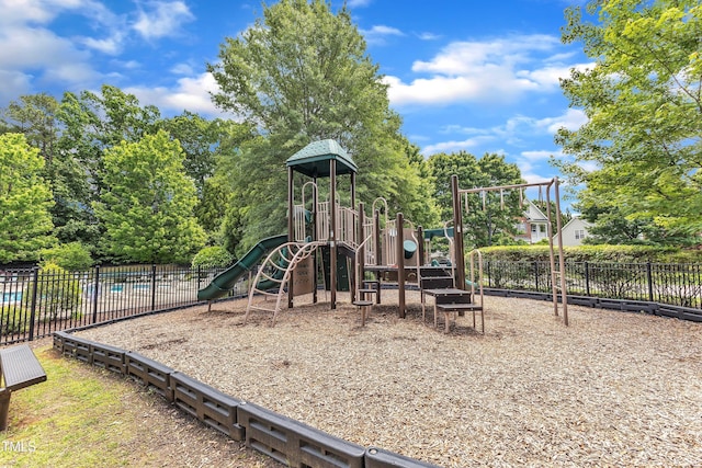 communal playground featuring fence