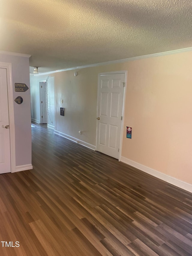 6060 Deans St, Bailey, NC 27807 - spare room featuring dark wood-style flooring, a textured ceiling, crown molding, and baseboards