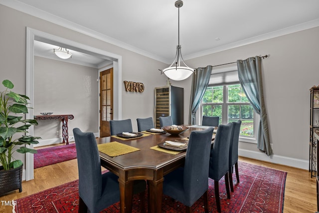 4306 Infinity Ln, Durham, NC 27705 - dining space featuring wood finished floors, ornamental molding, and baseboards