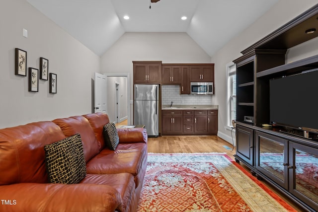 4306 Infinity Ln, Durham, NC 27705 - living area with light wood-style flooring, ceiling fan, high vaulted ceiling, and recessed lighting