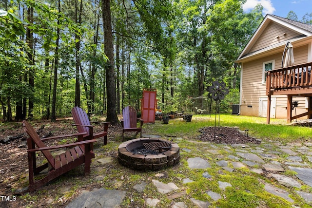4306 Infinity Ln, Durham, NC 27705 - view of yard with an outdoor fire pit, a deck, and central air condition unit
