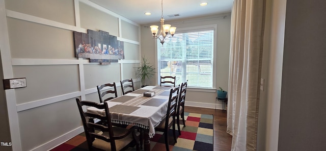 dining area featuring a chandelier, plenty of natural light, baseboards, ornamental molding, and recessed lighting