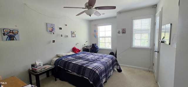 bedroom featuring multiple windows, carpet floors, ceiling fan, and baseboards
