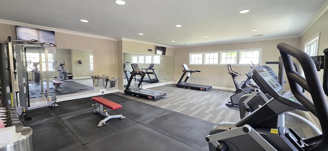 exercise room featuring ornamental molding, baseboards, and recessed lighting