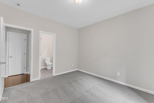 5025 Stonewood Pines Dr, Knightdale, NC 27545 - unfurnished bedroom with carpet flooring, baseboards, and ensuite bathroom