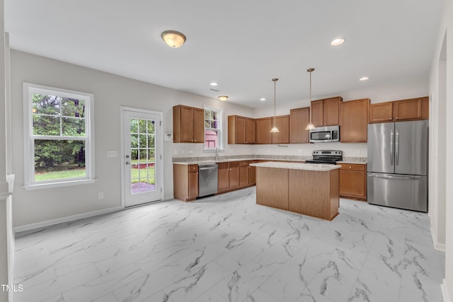 5025 Stonewood Pines Dr, Knightdale, NC 27545 - kitchen featuring stainless steel appliances, light countertops, light marble finish floors, baseboards, and recessed lighting