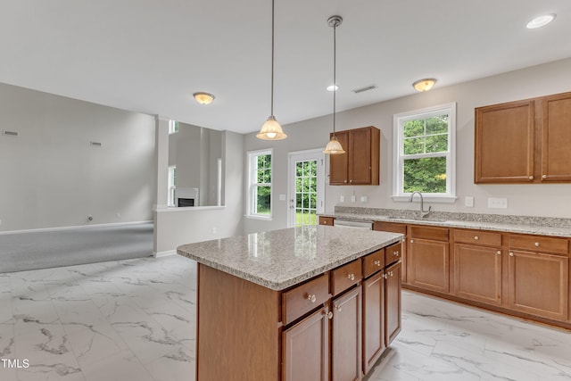 5025 Stonewood Pines Dr, Knightdale, NC 27545 - kitchen with light marble finish flooring, a sink, healthy amount of natural light, stainless steel dishwasher, and recessed lighting