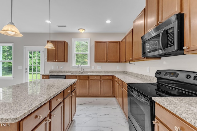 5025 Stonewood Pines Dr, Knightdale, NC 27545 - kitchen with stainless steel appliances, light marble finish flooring, a sink, brown cabinets, and recessed lighting