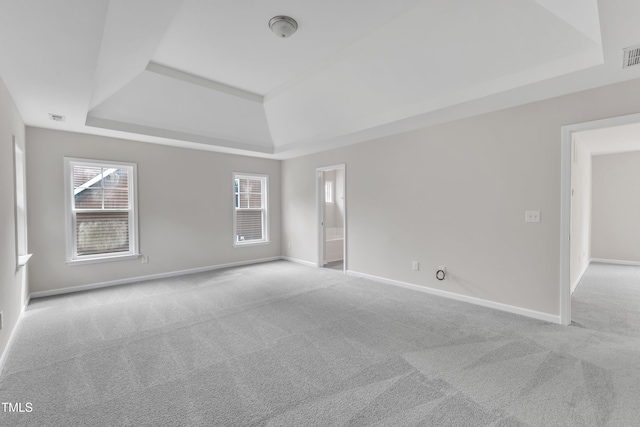 5025 Stonewood Pines Dr, Knightdale, NC 27545 - carpeted spare room with a tray ceiling and baseboards