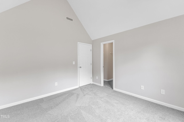 5025 Stonewood Pines Dr, Knightdale, NC 27545 - empty room featuring carpet, baseboards, and high vaulted ceiling