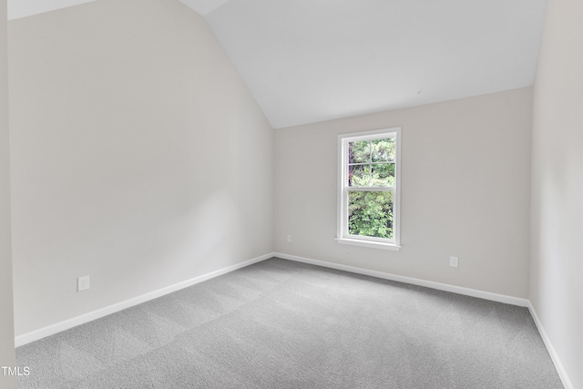 5025 Stonewood Pines Dr, Knightdale, NC 27545 - unfurnished room with vaulted ceiling, carpet floors, and baseboards