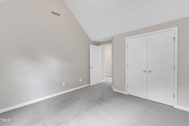5025 Stonewood Pines Dr, Knightdale, NC 27545 - unfurnished bedroom with carpet flooring, vaulted ceiling, baseboards, and a closet