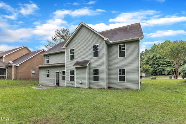 5025 Stonewood Pines Dr, Knightdale, NC 27545 - back of property featuring a yard, a patio area, and a shingled roof