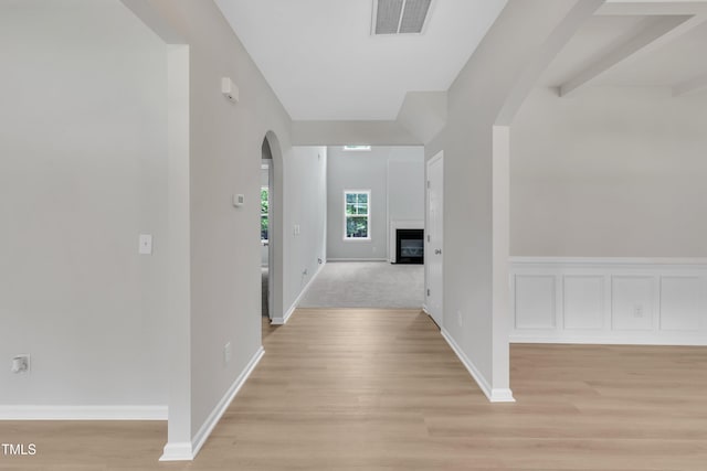 5025 Stonewood Pines Dr, Knightdale, NC 27545 - corridor with arched walkways, light wood-type flooring, and baseboards