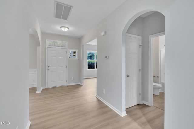 5025 Stonewood Pines Dr, Knightdale, NC 27545 - entrance foyer with light wood finished floors, arched walkways, and baseboards
