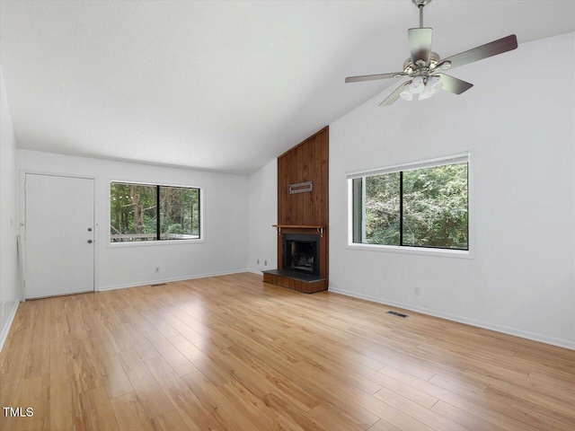 152A Cedar Ter, Chapel Hill, NC 27516 - unfurnished living room with a ceiling fan, a large fireplace, light wood-style floors, and high vaulted ceiling