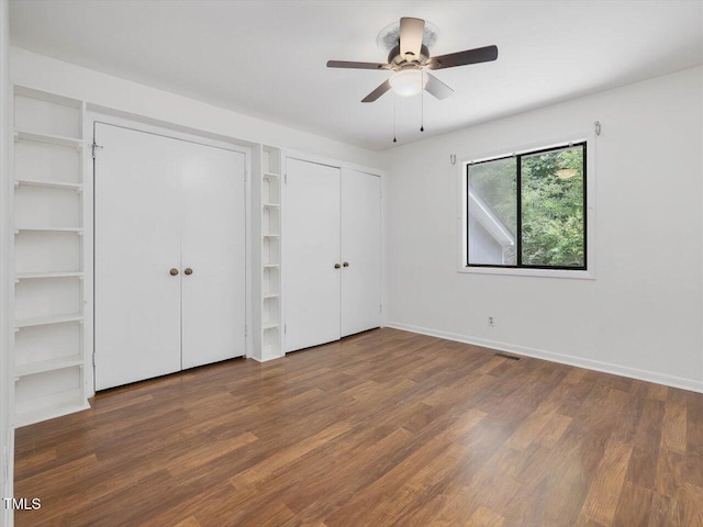 152A Cedar Ter, Chapel Hill, NC 27516 - unfurnished bedroom with two closets, wood finished floors, and a ceiling fan