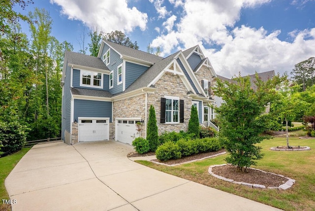 view of front facade with stone siding, an attached garage, driveway, and a shingled roof