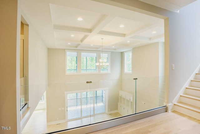 bathroom featuring coffered ceiling, a chandelier, wood finished floors, beamed ceiling, and recessed lighting