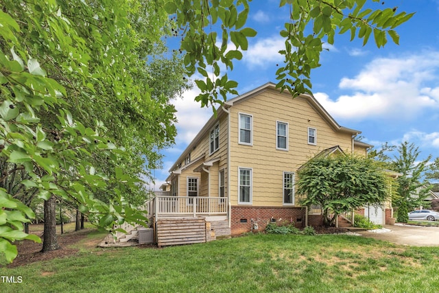 view of property exterior with crawl space, a lawn, a wooden deck, and central AC unit