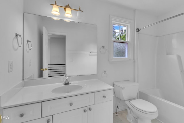 full bath featuring vanity, toilet, and bathtub / shower combination