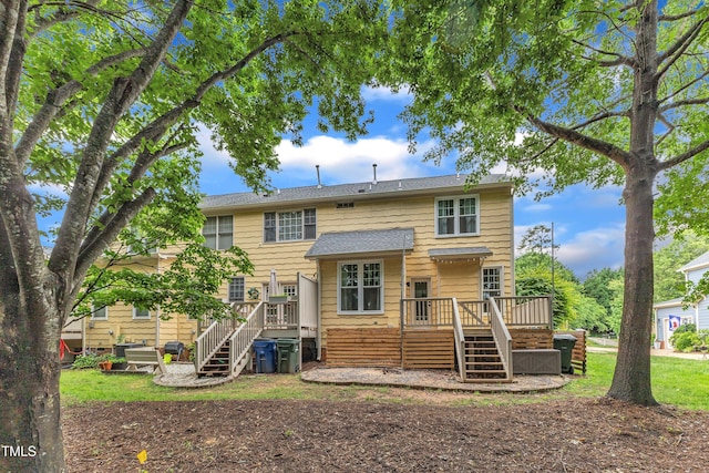 back of house with stairs and a deck