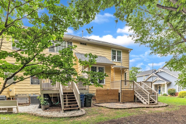 back of house featuring stairs, a deck, central AC unit, and a shingled roof