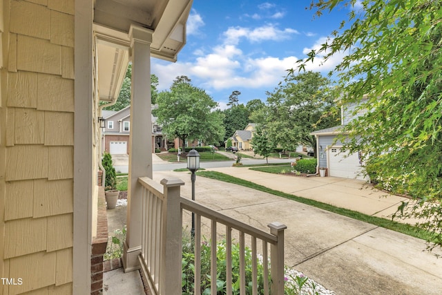 view of patio / terrace with a porch and a residential view