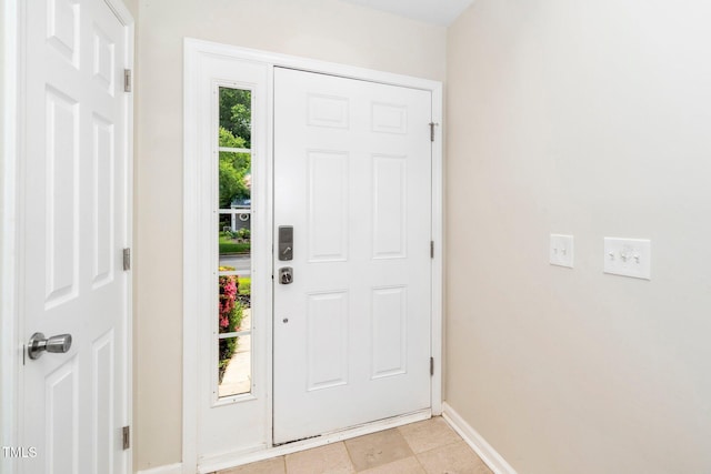 entryway featuring baseboards