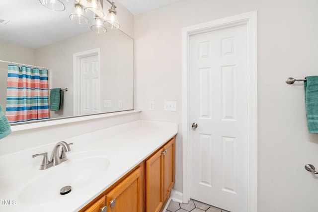 full bath featuring vanity, tile patterned floors, and a shower with shower curtain
