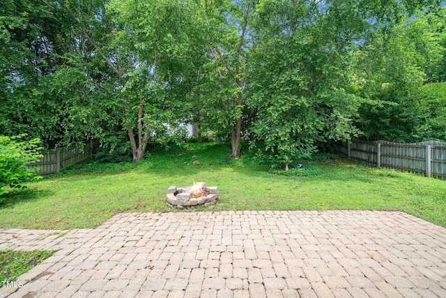 view of patio with a fire pit